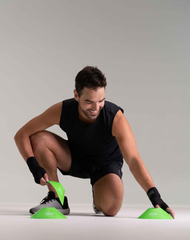 Gym member smiling softly and looking at the floor